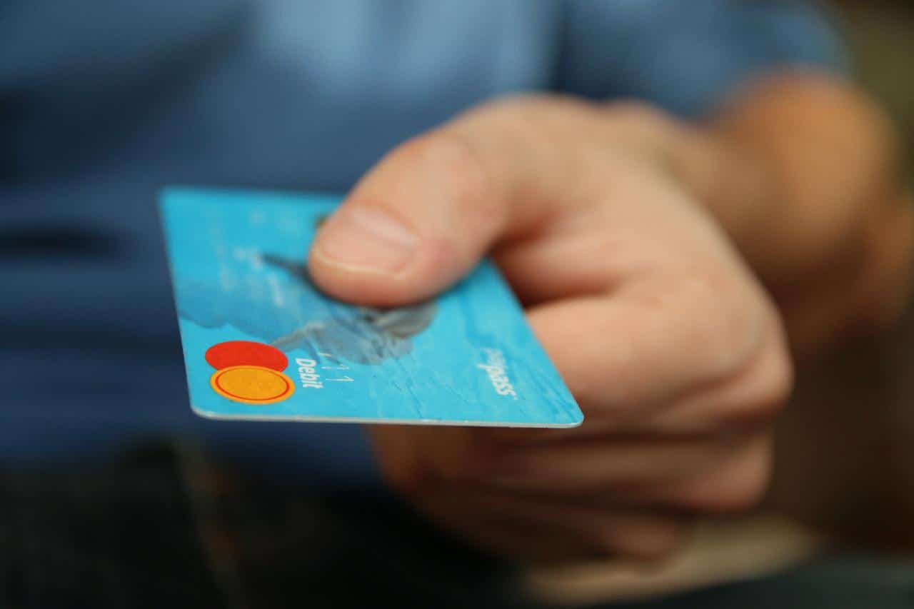 man holding credit card in peru