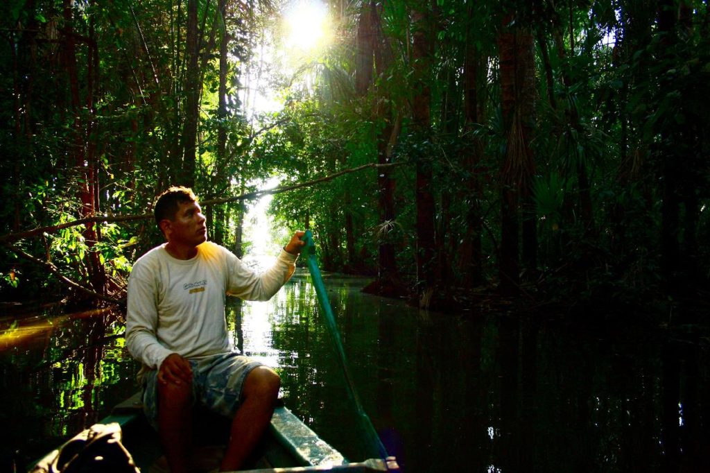 man boating in the amazon