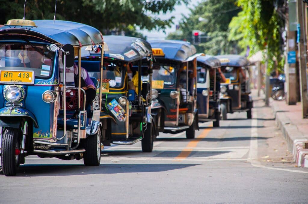 tuk-tuks in a line in chiang mai, thailand