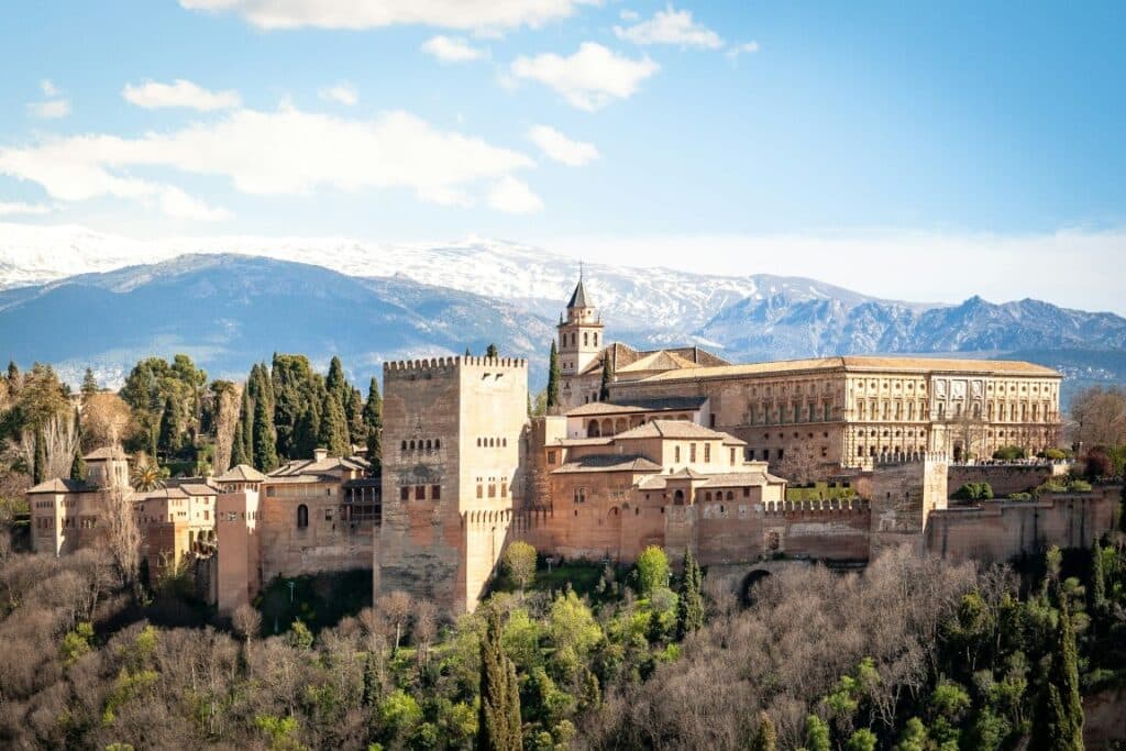 Alhambra palace in spring, Granada, Spain. In early April the mountains are still covered in snow.