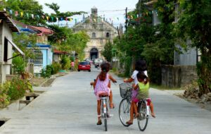 kids in front of a church in paoay philippines