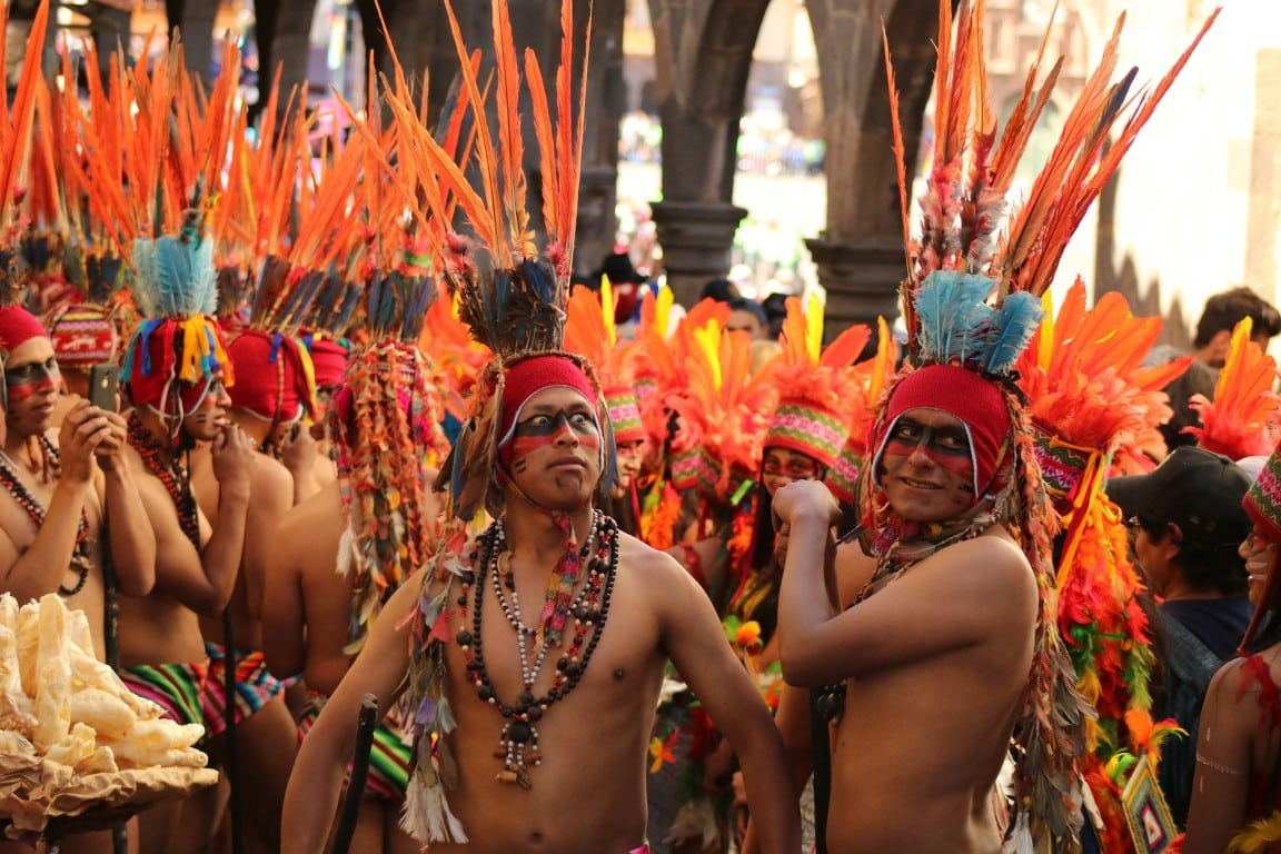 men dressed in cultural attire in peru