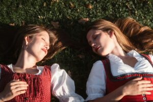 ladies sleeping on the grass