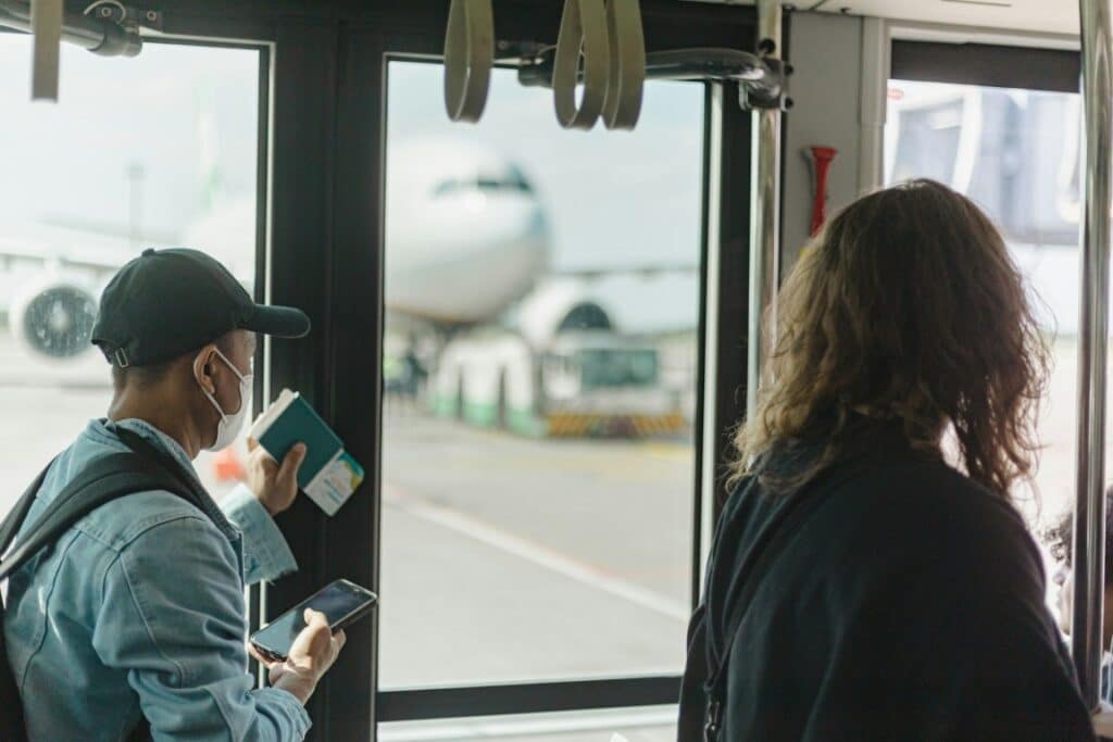 person holding a passport in the airport