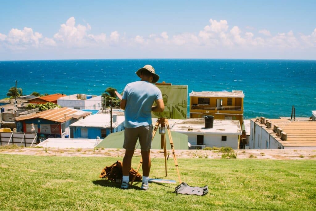 man taking a lanscape photo of a section of the sea in puerto rico